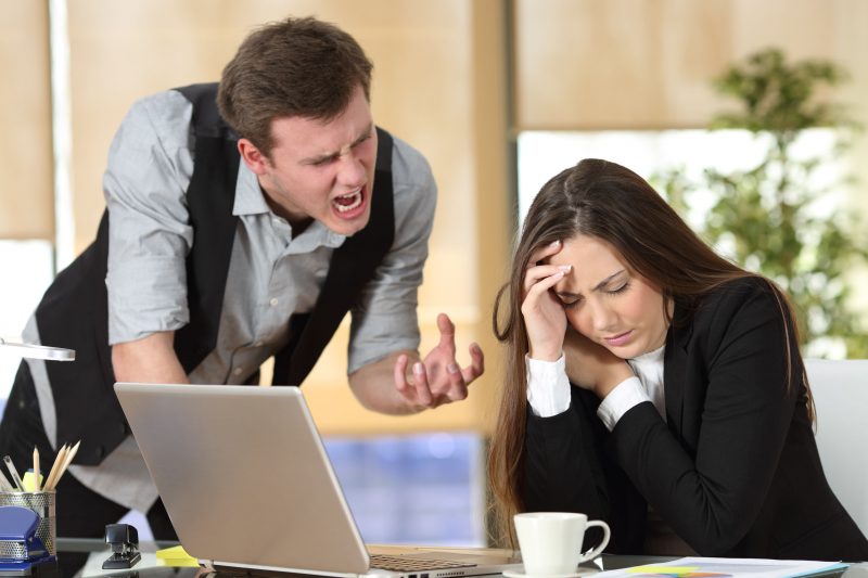 Bullying with a boss shouting to an employee Threatening man