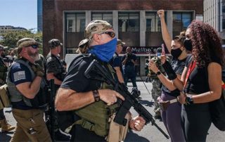 Standoff between armed Trump fans and BLM protesters
