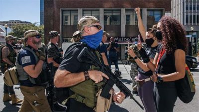 Standoff between armed Trump fans and BLM protesters